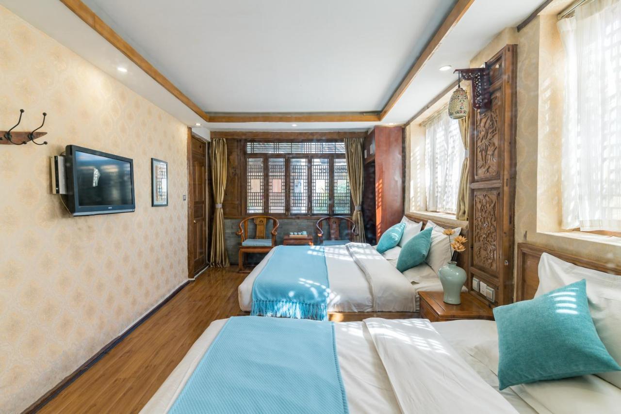 He Mu Ju Inn Zhongyi Branch Лицзян Экстерьер фото