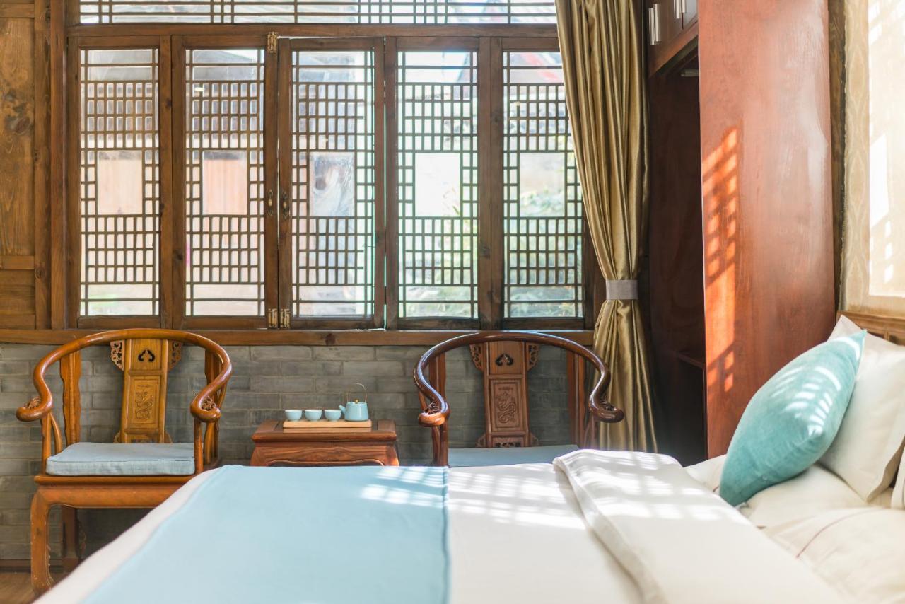 He Mu Ju Inn Zhongyi Branch Лицзян Экстерьер фото